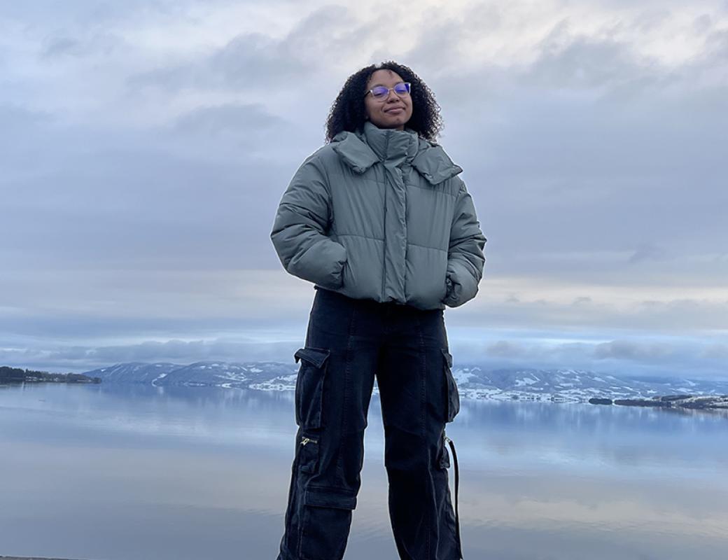 Garl standing in front of a wide lake